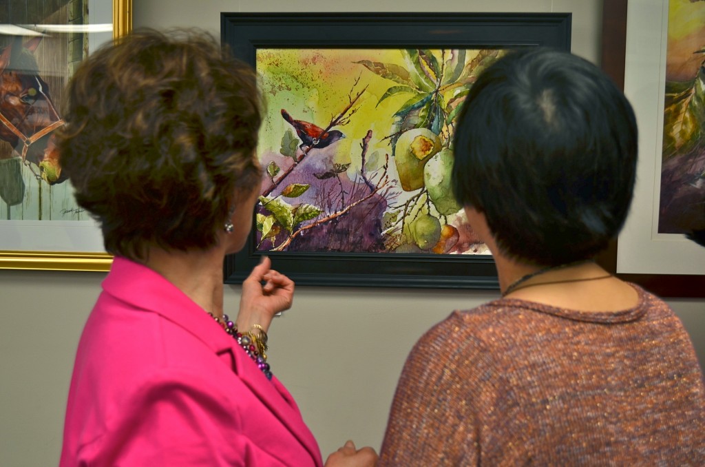 PAG President Nelia Tonido shows her friends one of her paintings