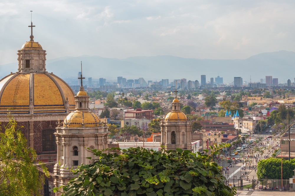 Old Basilica of Guadalupe with Mexico City. ShutterStock image