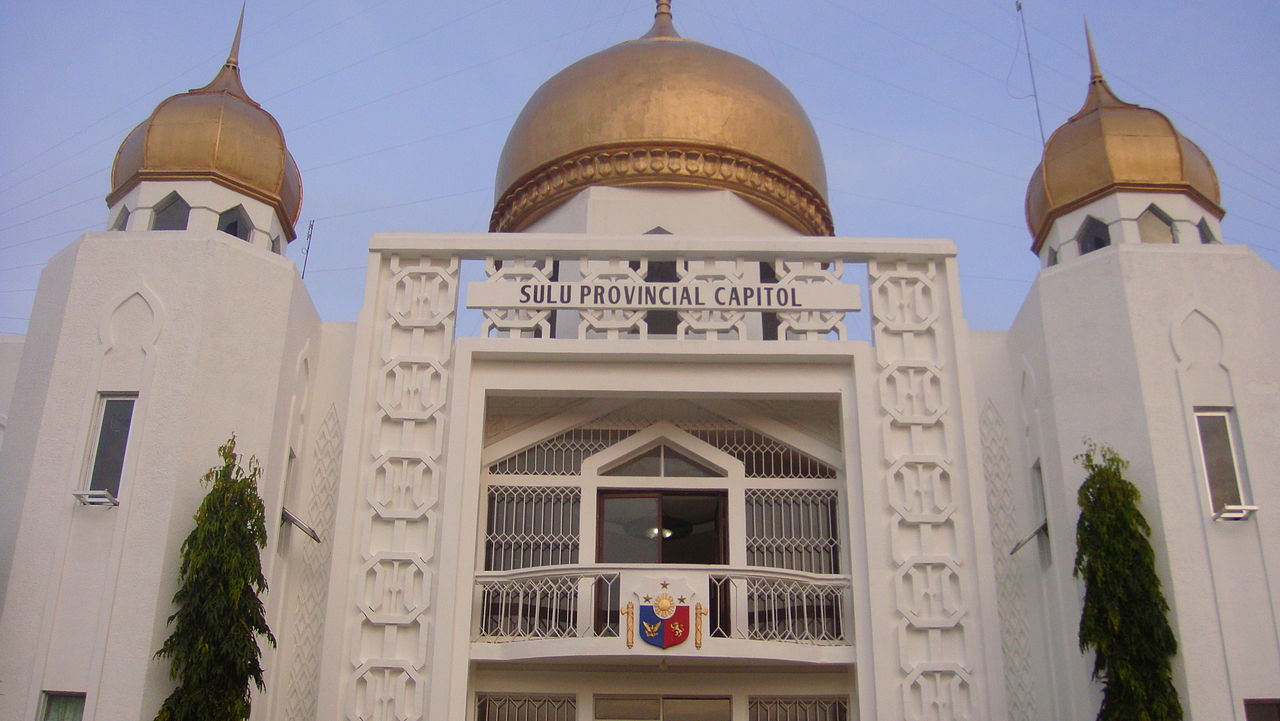The façade of the Sulu Provincial Capitol building — in Jolo, Sulu Province, Autonomous Region in Muslim Mindanao. Photo by Agtillah / Wikimedia Commons.</p><p id=
