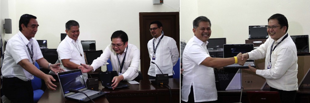 Bureau of Custom (BOC) Commissioner John Philip Sevilla (at right) hands over the one of the 3,915 computer laptops to Department of Education (DepEd) Secretary Bro Armin Luistro during the ceremonial turnover of the seized smuggled laptops on Thursday (August 28, 2014) at the BOC head office in Port Area, Manila. Luistro said 2,000 of these laptops will be issued to the Mobile Teachers and Abot Alam Programs to enhance the computerization program of the DepEd. (PNA photos by Avito C. Dalan)