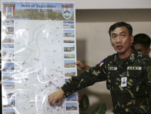 Commanding Officer of the Armed Forces of the Philippines Peacekeeping Operations Center, points to an area of a map where peacekeepers are stationed in Golan Heights. Photo courtesy of Aaron Favila.