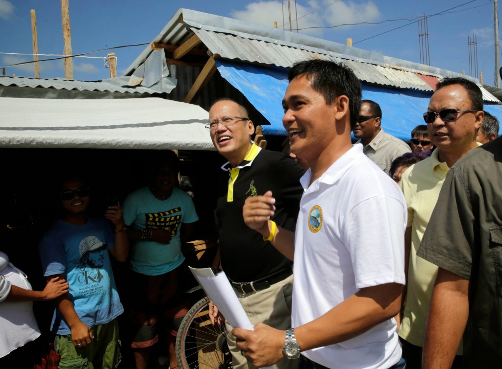 President Benigno S. Aquino III listens to the updates on the on-going rehabilitation efforts by Guiuan Municipal Mayor Christopher Sheen Gonzales at the Guiuan Public Market in Barangay 6, Poblacion during the visit to the province of Eastern Samar on Friday (November 07). It was in Guiuan where super typhoon Yolanda, the strongest typhoon ever recorded, made its first landfall on November 08, 2013. (Photo by Gil Nartea/ Malacañang Photo bureau)