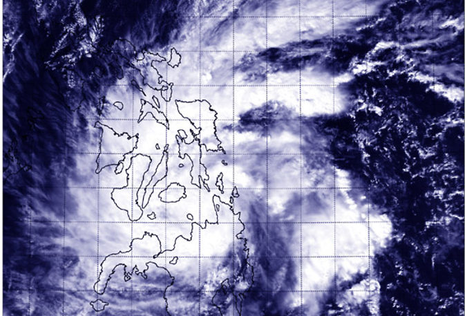 NASA's Aqua satellite captured this image of Tropical Storm Jangmi over the central and southern Philippines on Dec. 29 at 5:05 UTC. NASA / NRL.