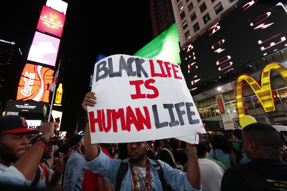 Thousands of New Yorkers responded to Anonymous's call for a Day of Rage march & rally to demand justice for the police-related deaths of Michael Brown & Eric Garner. a katz / Shutterstock.com.