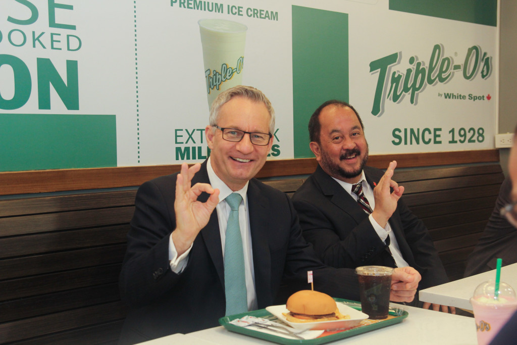 Minister Fast and Senator Enverga enjoy burgers made from Canadian beef at Triple-O's