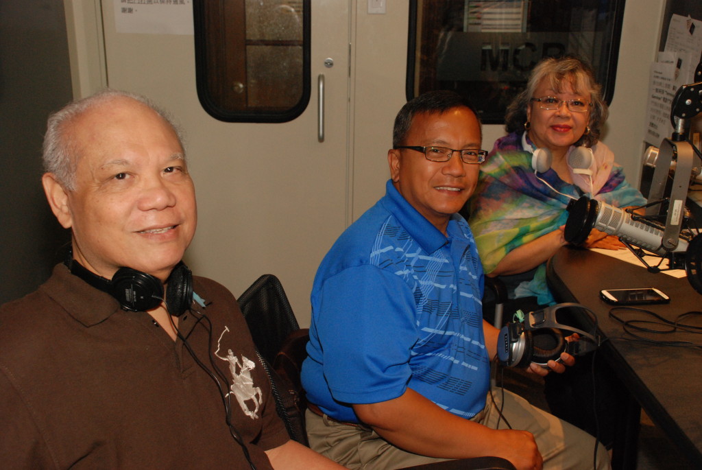 Popular Fil-Can lawyer Rafael Fabregas, guest of Talakayan Radyo Filipino AM1430, poses with Co-anchor Karen Tan (standing) and political commentator Tony A. San Juan (right) during an on-air interview short break at Fairchild Radio Network in Thornhill, Ontario on June 6, 2015. Fabregas answers questions pertaining to Canadian immigration  and citizenship laws and regulations impacting the Filipino community. (Photo: Nelson Galvez)