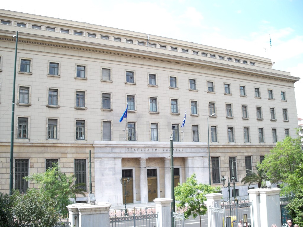 Main building of the bank of Greece. Recently, the country has been forced to close its banks, limit ATM withdrawals to 60 euros a day and  prohibit residents from making remittances abroad due to the economic crisis. (Photo courtesy of Wikipedia Commons)