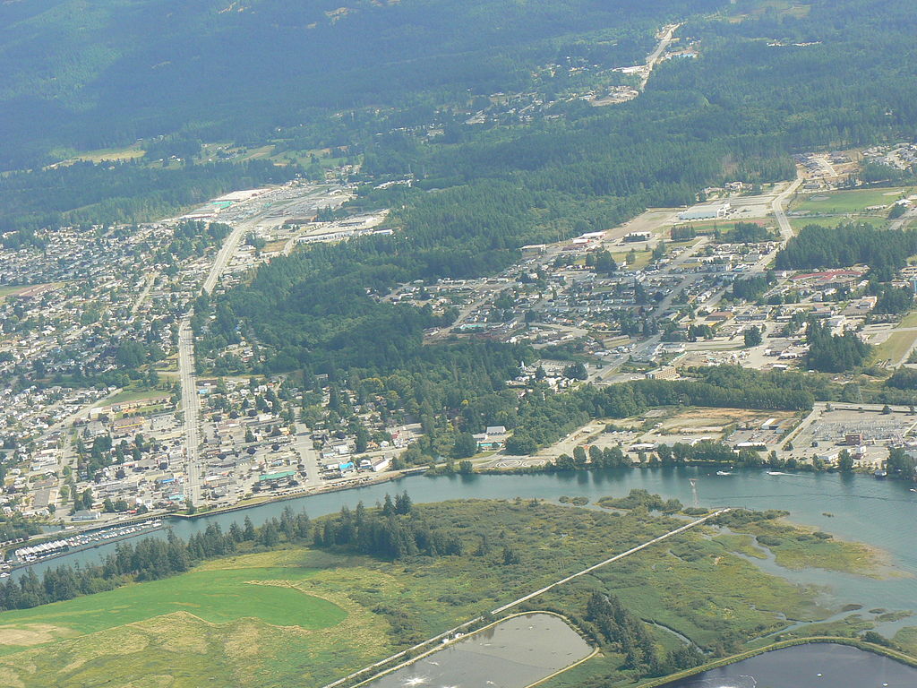Aerial view of central Port Alberni showing the Somass entering the Alberni Inlet. (Photo from Wikipedia/ Kevstan)
