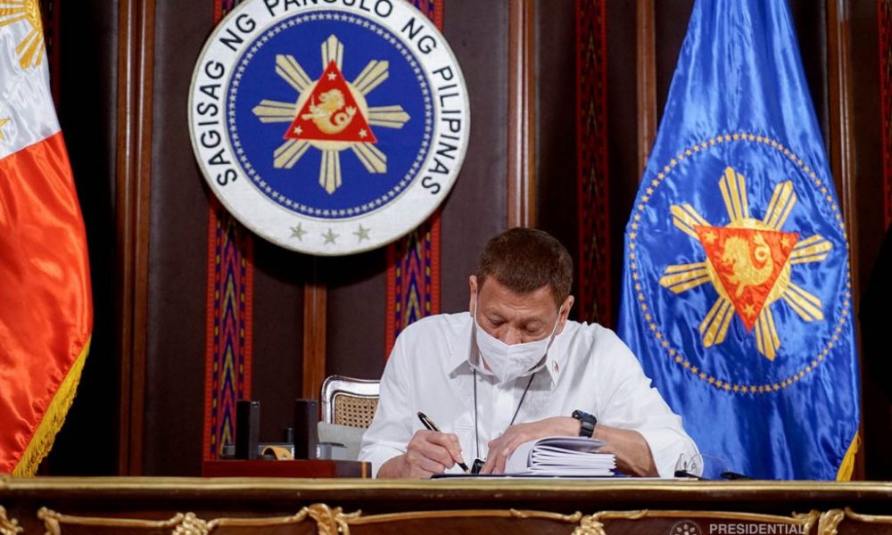 President Duterte signing papers