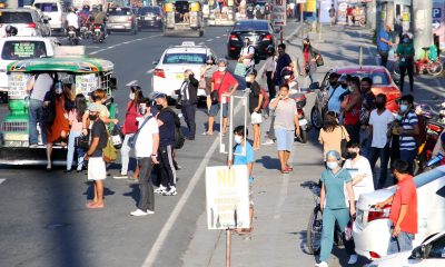 Commuters waiting for rides in Marcos Highway