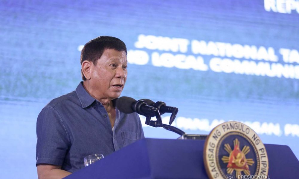 Duterte giving a speech in a podium