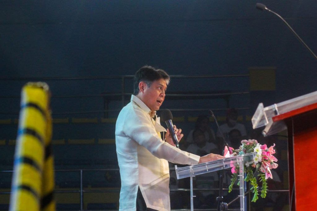 Kiko Pangilinan standing and speaking in podium