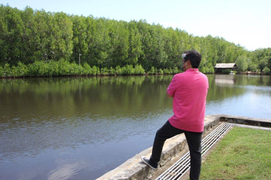 Kiko Pangilinan looking at a lake view