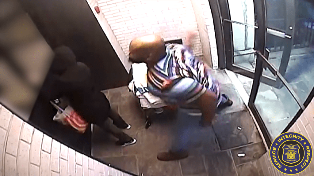 Man approaching a woman from behind