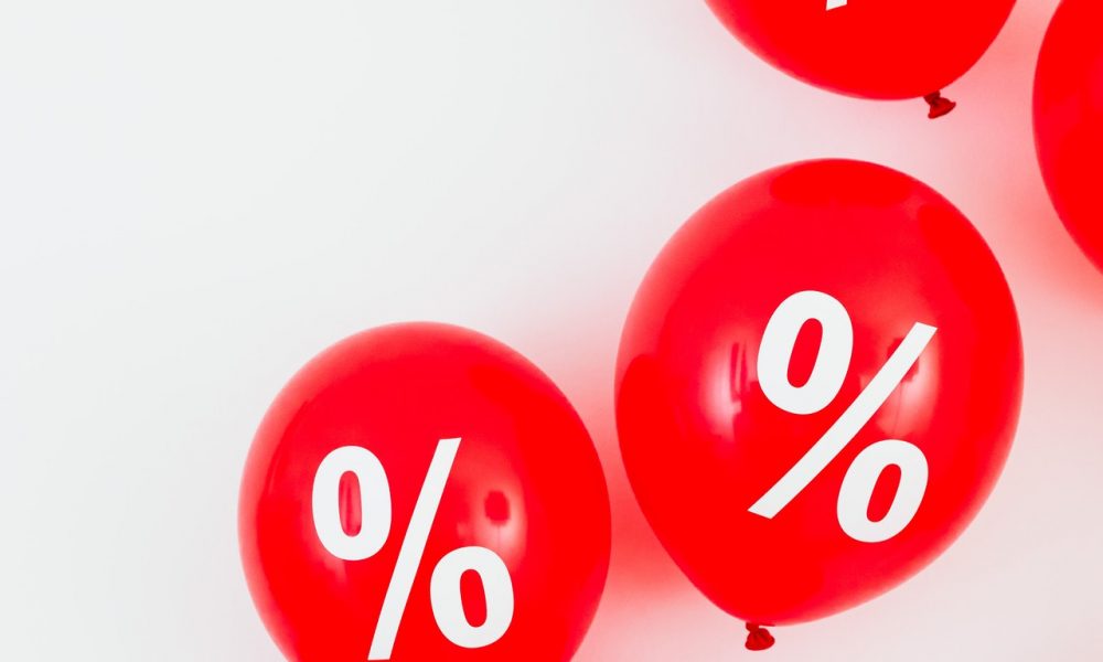 Percent sign on red balloons