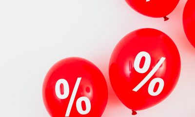 Percent sign on red balloons