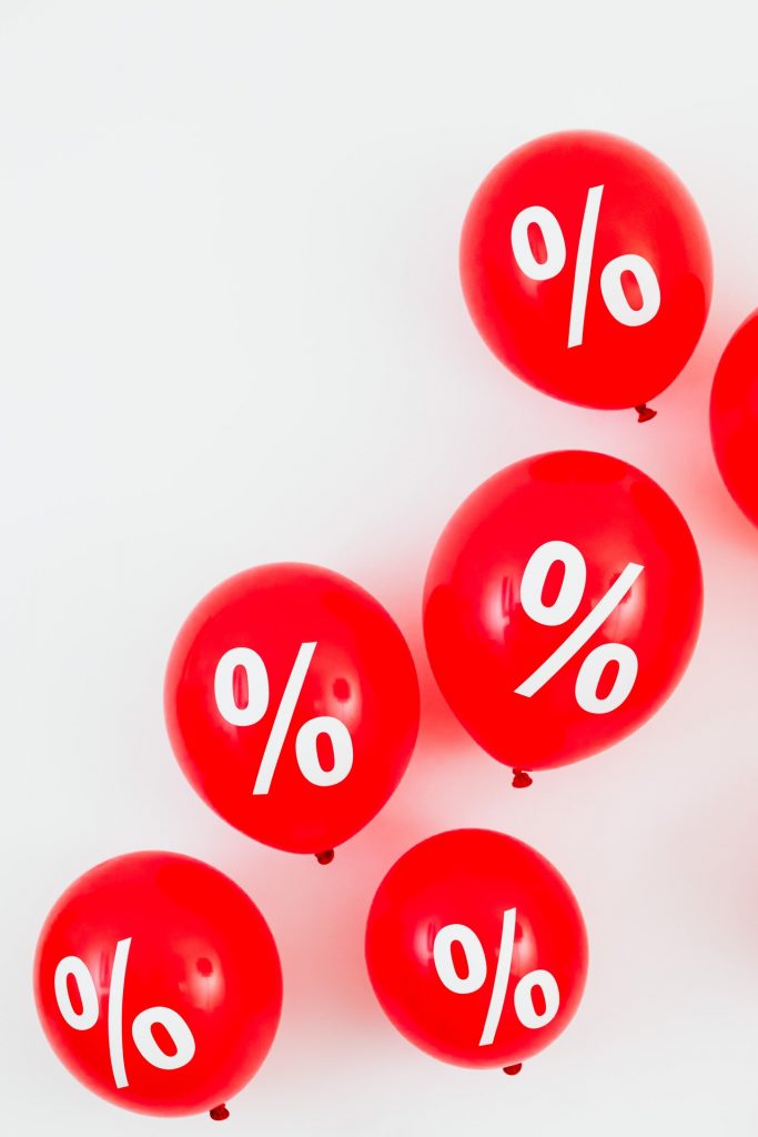 Percent sign on red balloons