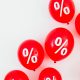 Percent sign on red balloons