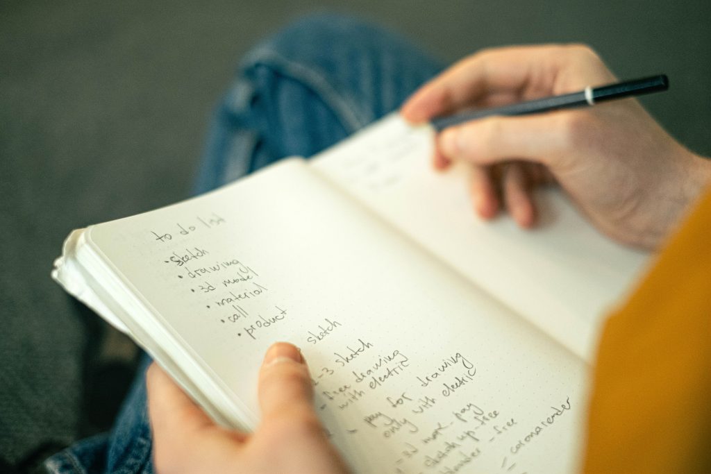 Person writing a to-do list