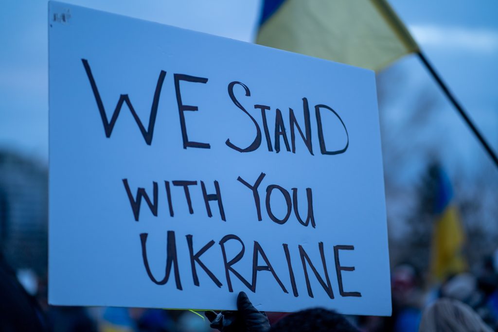 Placard that reads: "We stand with you Ukraine"