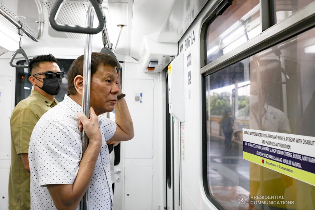 President Rodrigo Duterte rides the Metro Rail Transit Line-3