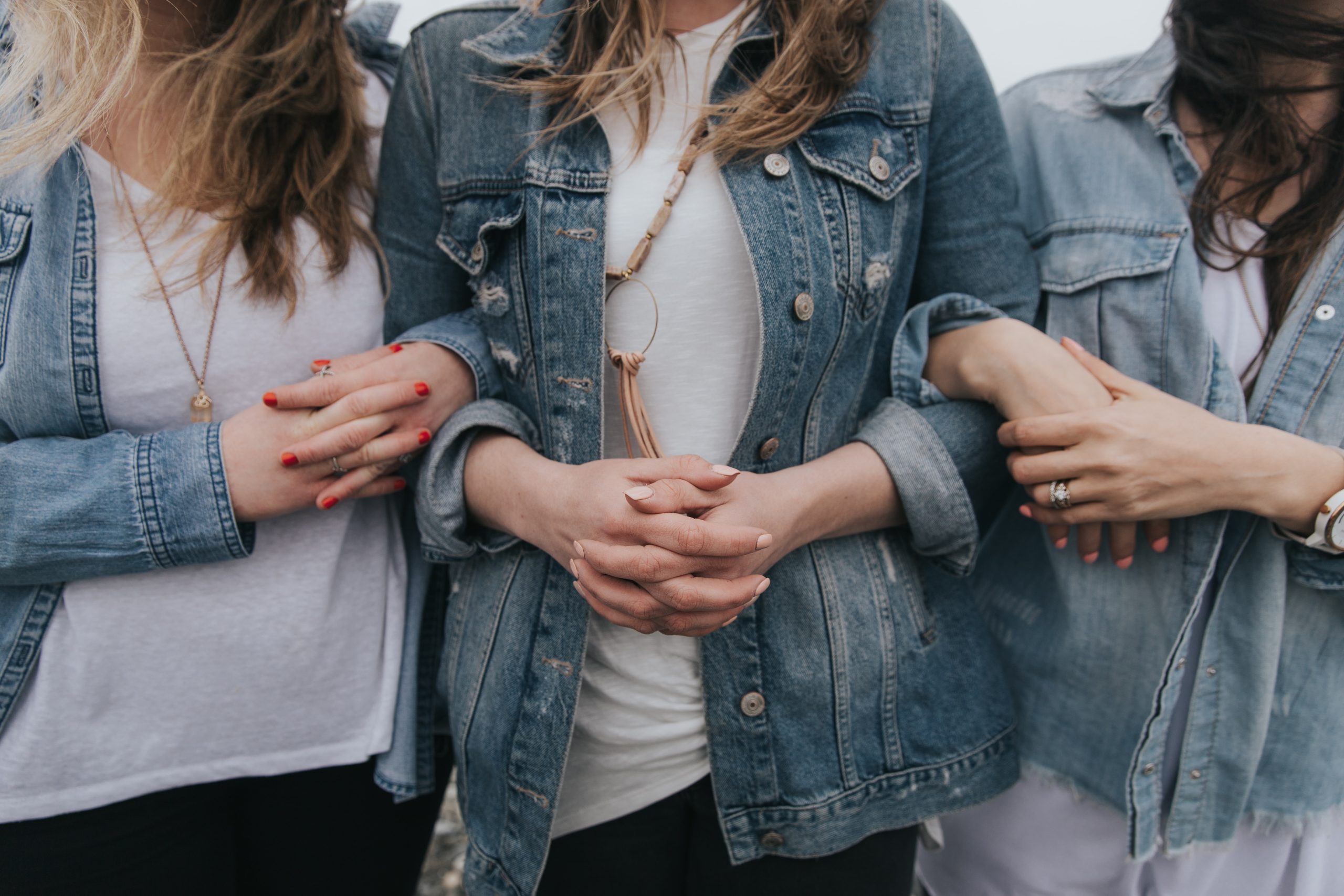 women in blue denim jacket and white shirt