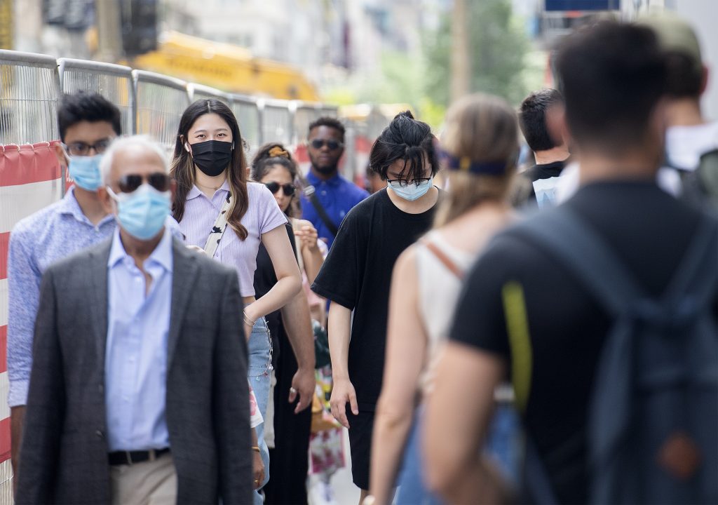 People walking wearing facemask