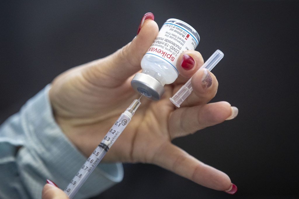 A vaccine is drawn out during a drive-through COVID-19 vaccine clinic 