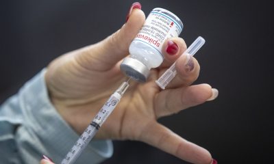 A vaccine is drawn out during a drive-through COVID-19 vaccine clinic