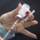 A vaccine is drawn out during a drive-through COVID-19 vaccine clinic