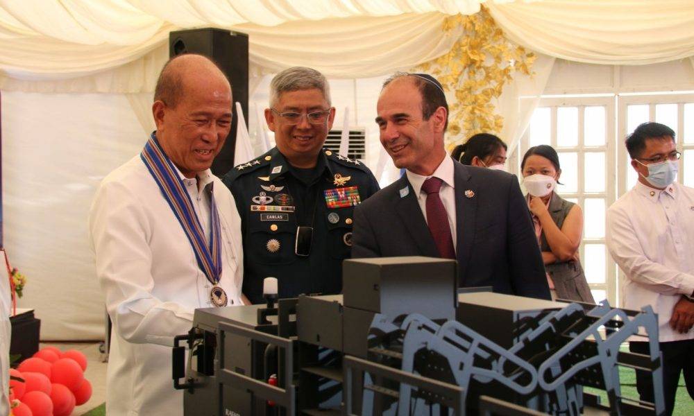 Defense Secretary Delfin Lorenzana (left) checks out a model of the SPYDER missile simulator with Israeli Ambassador Ian Fluss (right) and Philippine Air Force chief Lt. Gen. Connor Anthony Canlas Sr. (center)