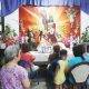 Residents start reading the passion of Christ after a short prayer at the house on Liwag Street corner Delos Reyes Road, Pambuan in Nueva Ecija