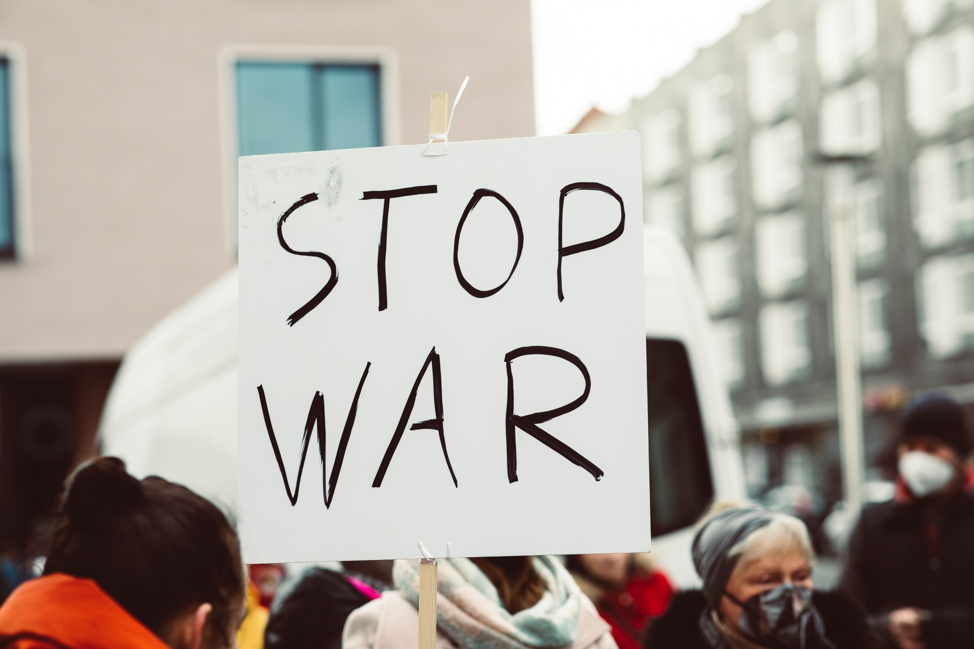 Card held with the words Stop War written