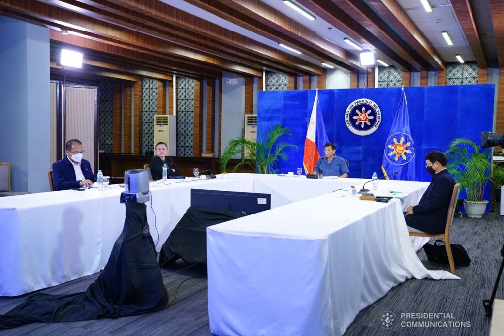 President Duterte presiding over a meeting with government officials