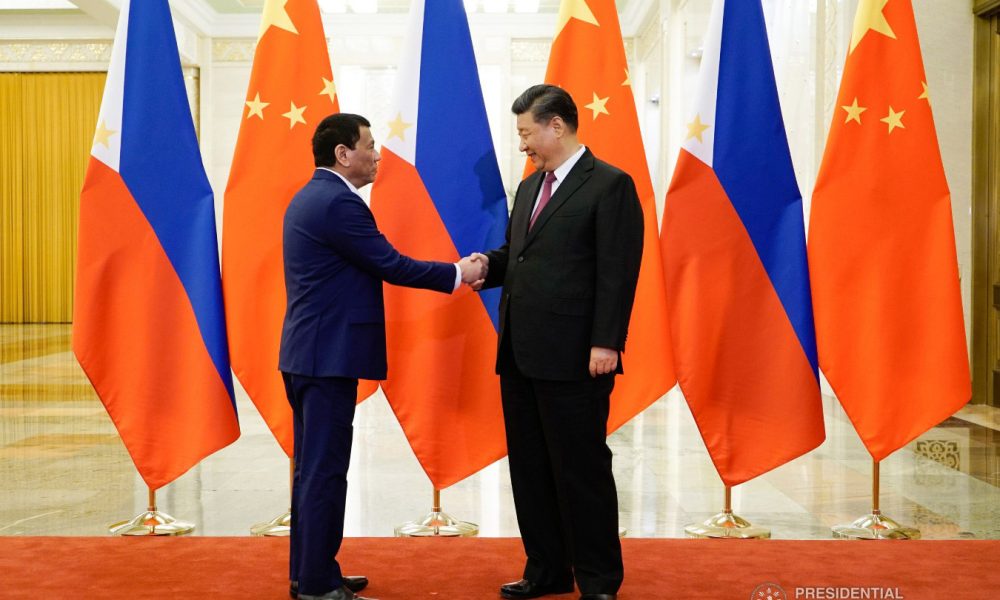President Duterte shaking hands with President Xi Jinping