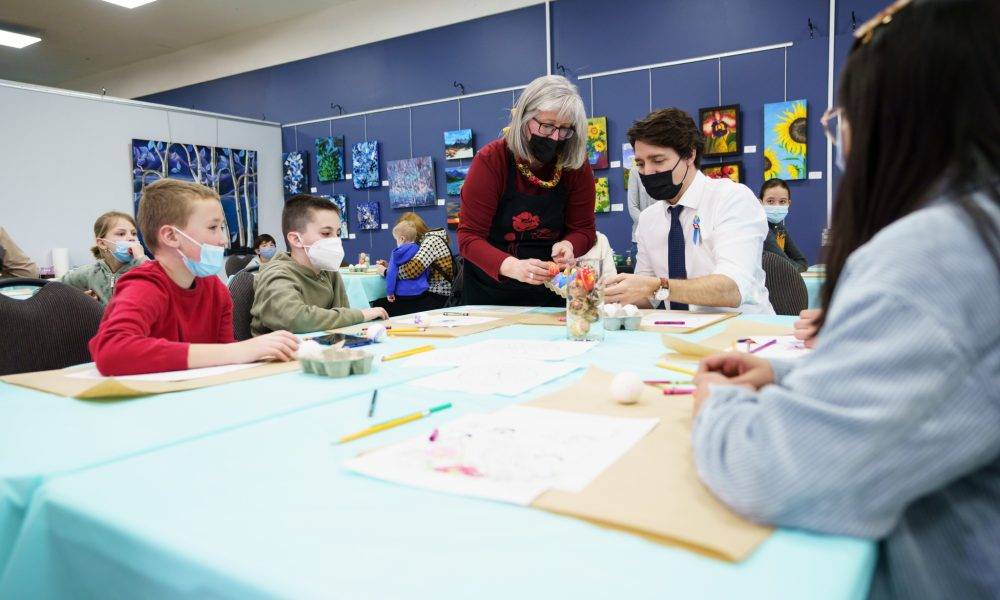 Trudeau painting Easter eggs with kids