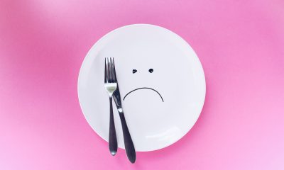 White plate with a sad face drawn on it