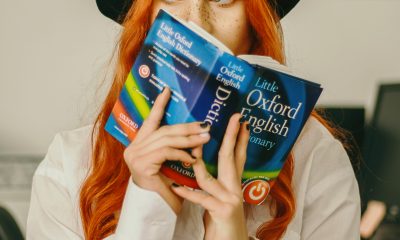 Woman holding Oxford English dictionary