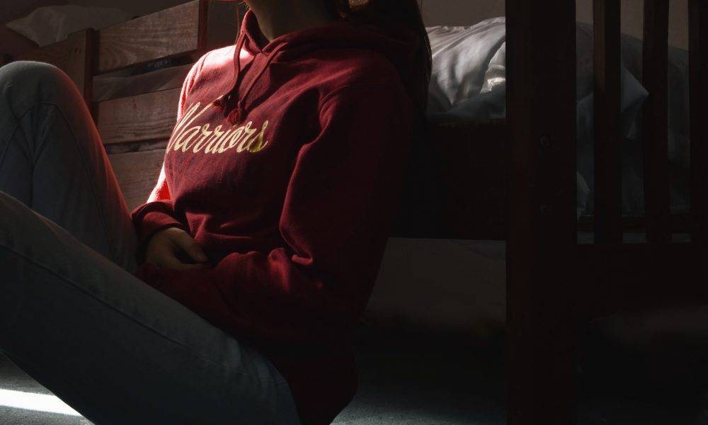 Woman sitting on floor