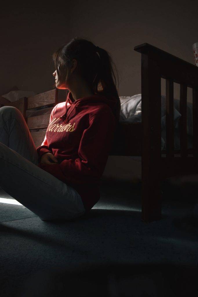 Woman sitting on floor
