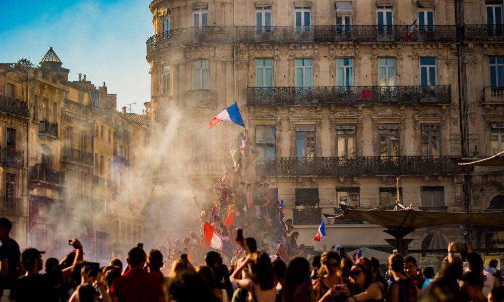 french crowd raising france flag