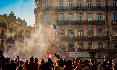 french crowd raising france flag