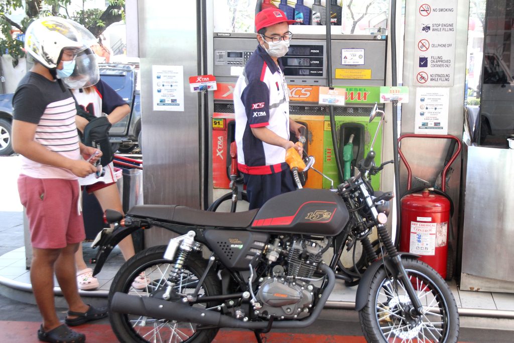 Pumping fuel at a gasoline station