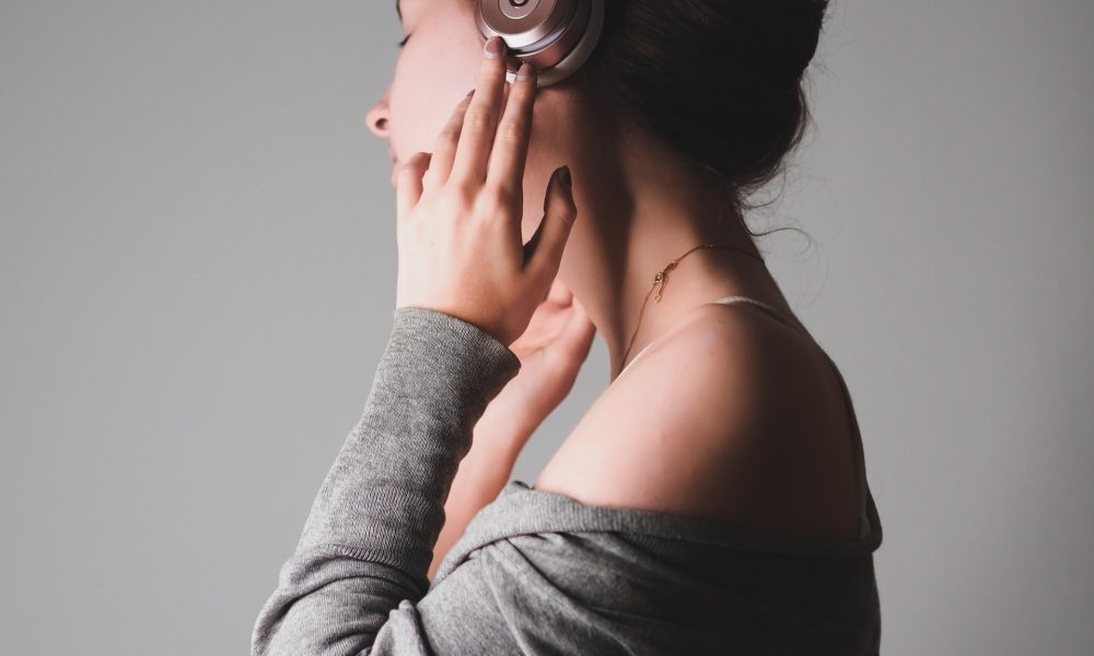 girl listening on headphones