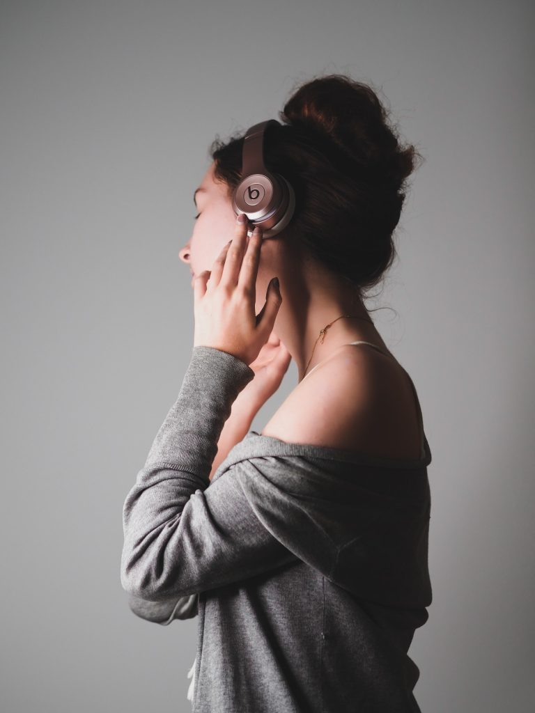 girl listening on headphones