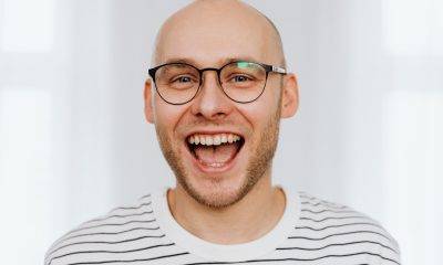 Man with Black Framed Eyeglasses Laughing