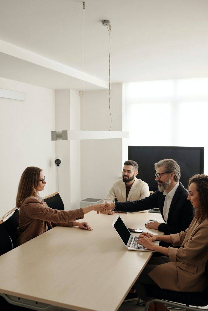 shaking hands in a meeting