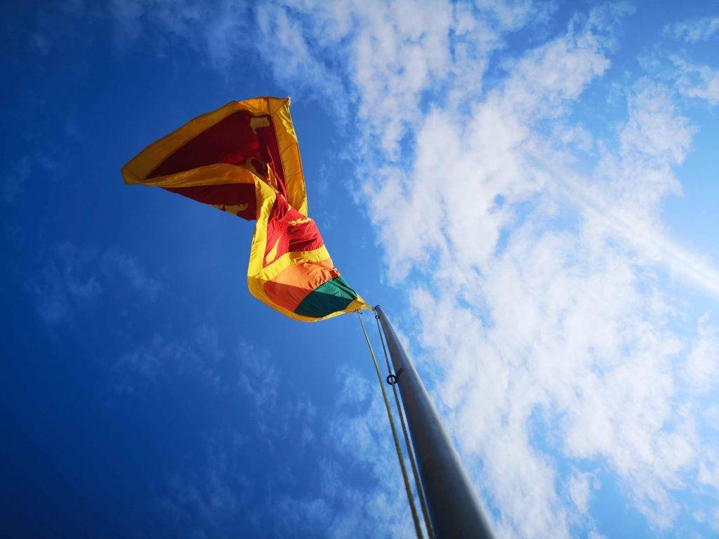 sri lanka flag raised on a flag pole