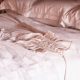 white corset laid on a bed