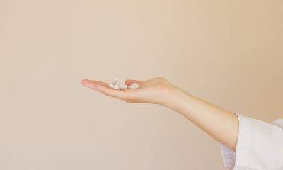 white pills on palm